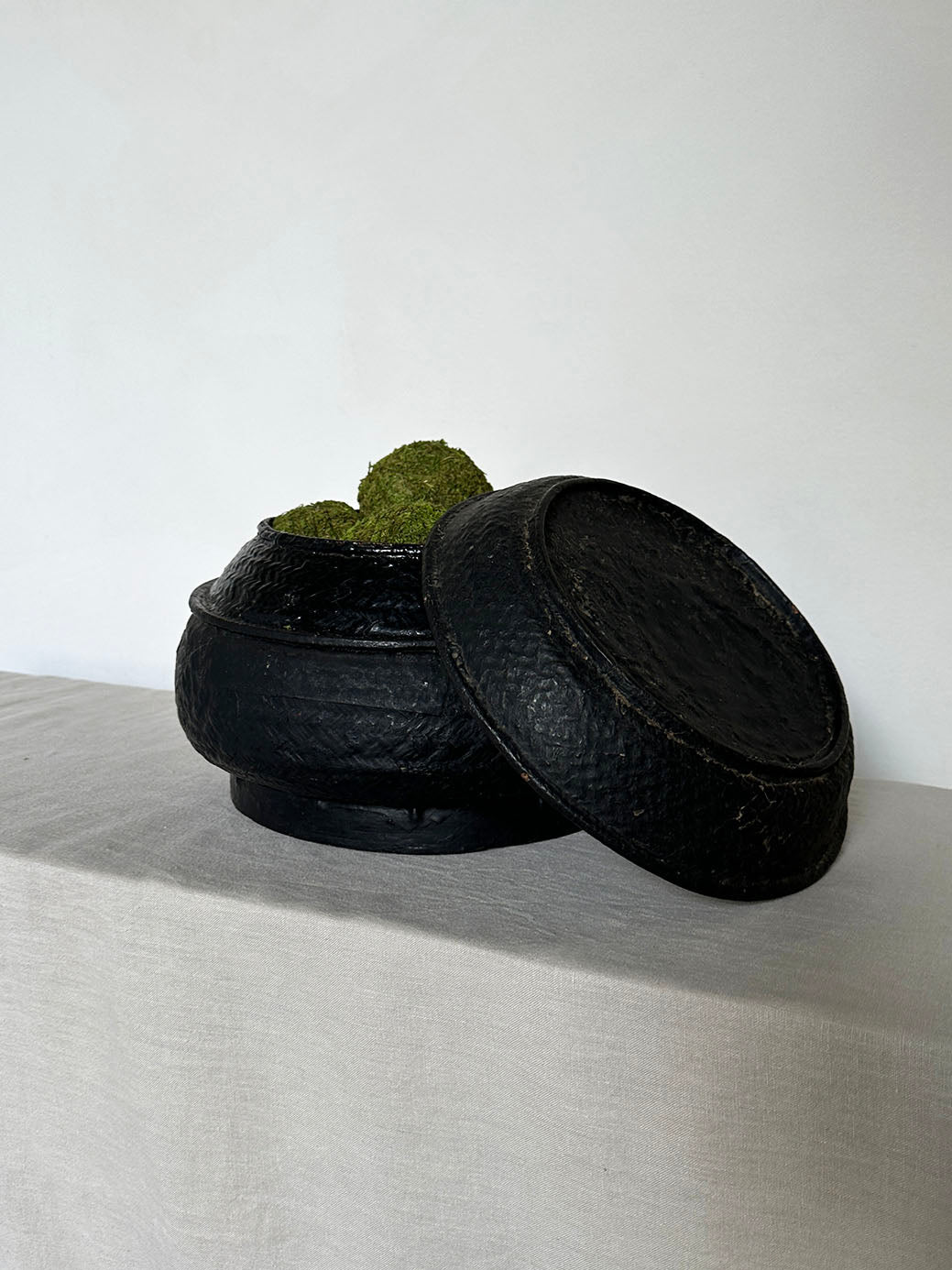 a beautiful hand-woven lidded basket with a primitive, wabi-sabi feel