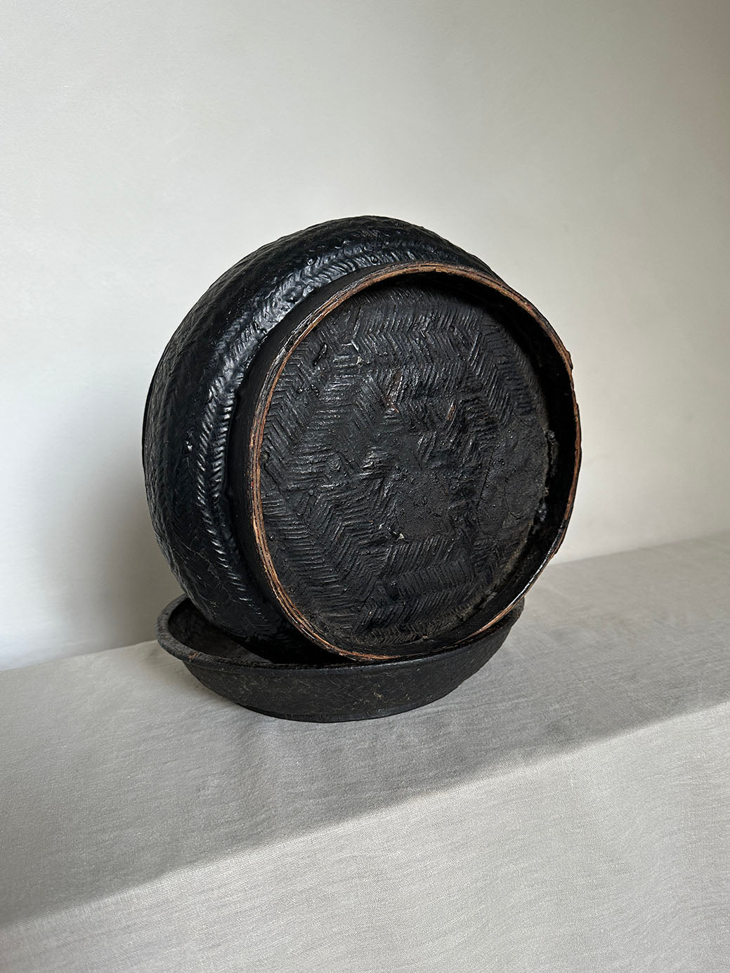 a beautiful hand-woven lidded basket with a primitive, wabi-sabi feel