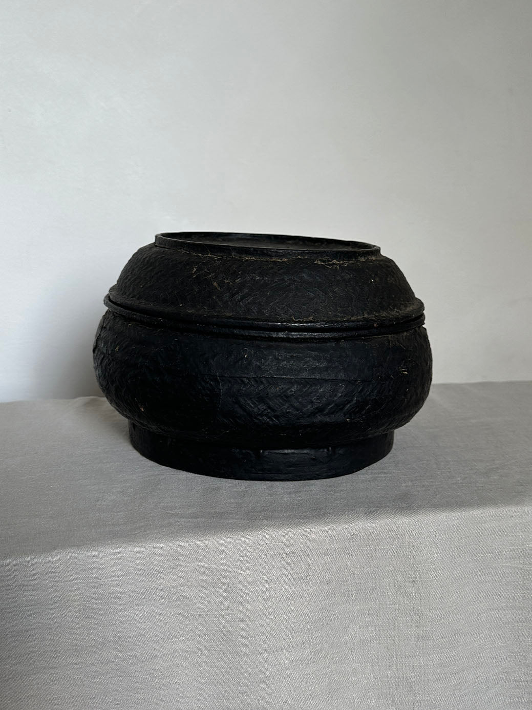 a beautiful hand-woven lidded basket with a primitive, wabi-sabi feel
