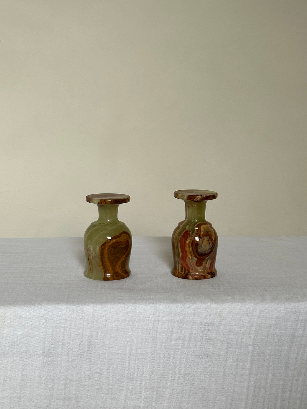 a pair of vintage onyx egg cups, originally designed as shot glasses