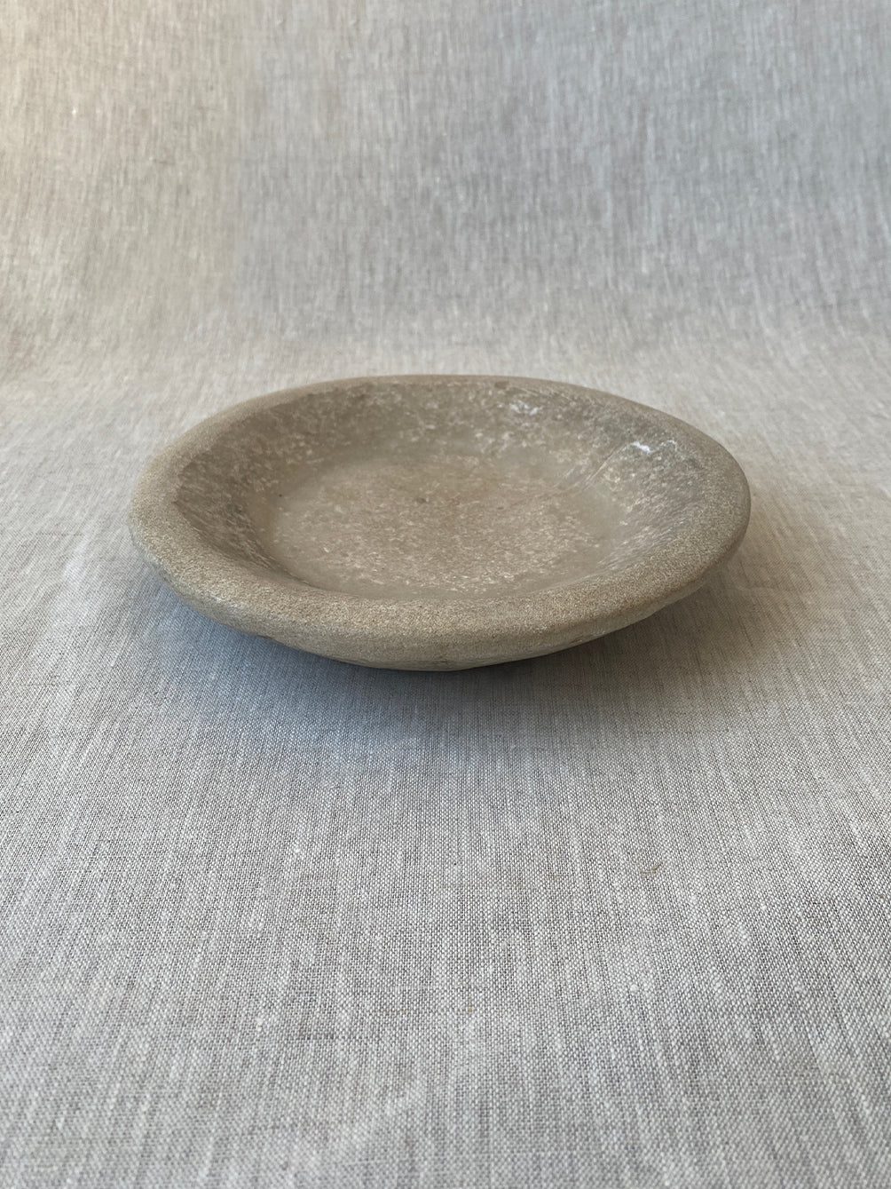 a hand-carved Indian marble bowl with an organic form and texture