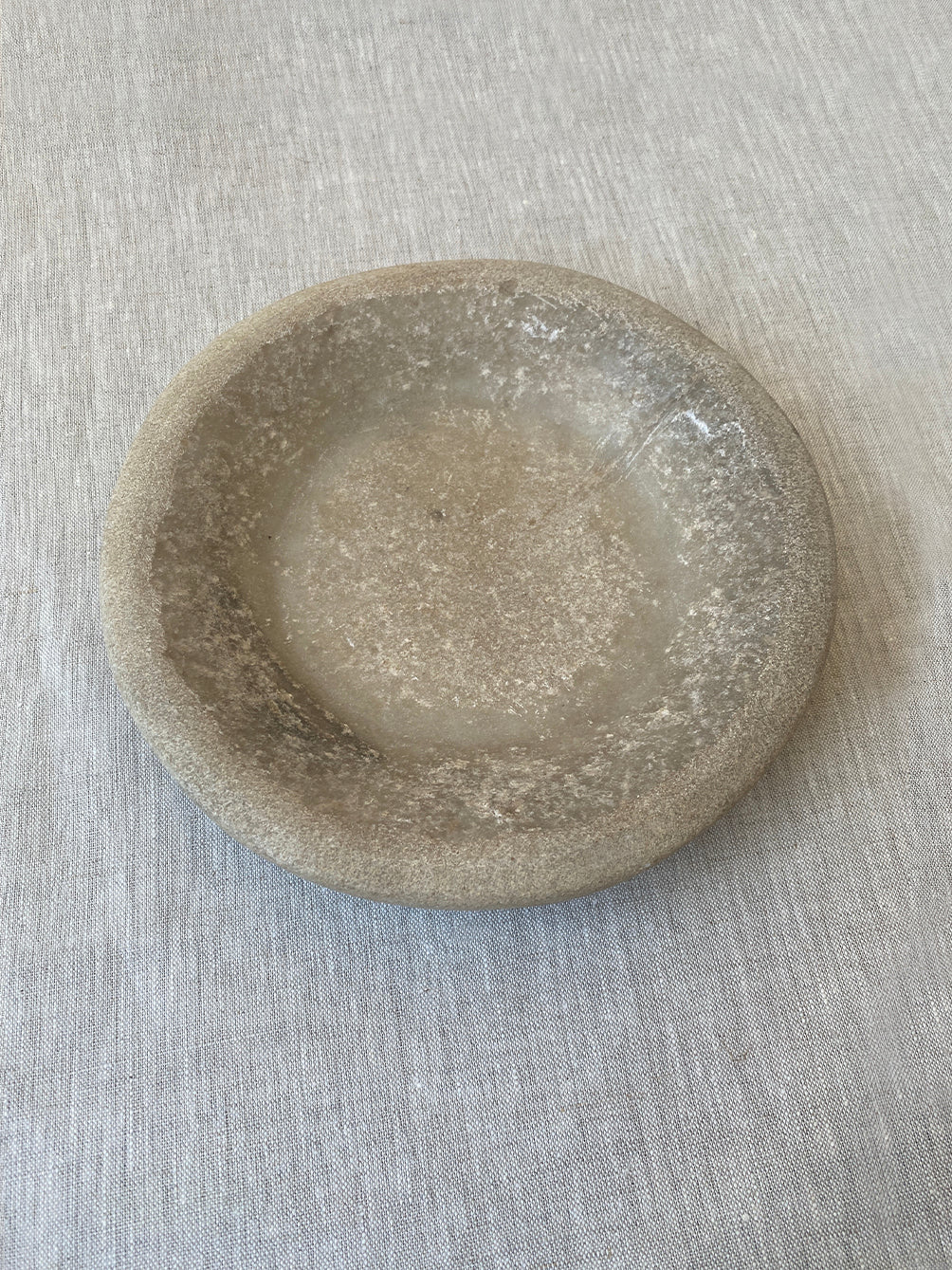 a hand-carved Indian marble bowl with an organic form and texture