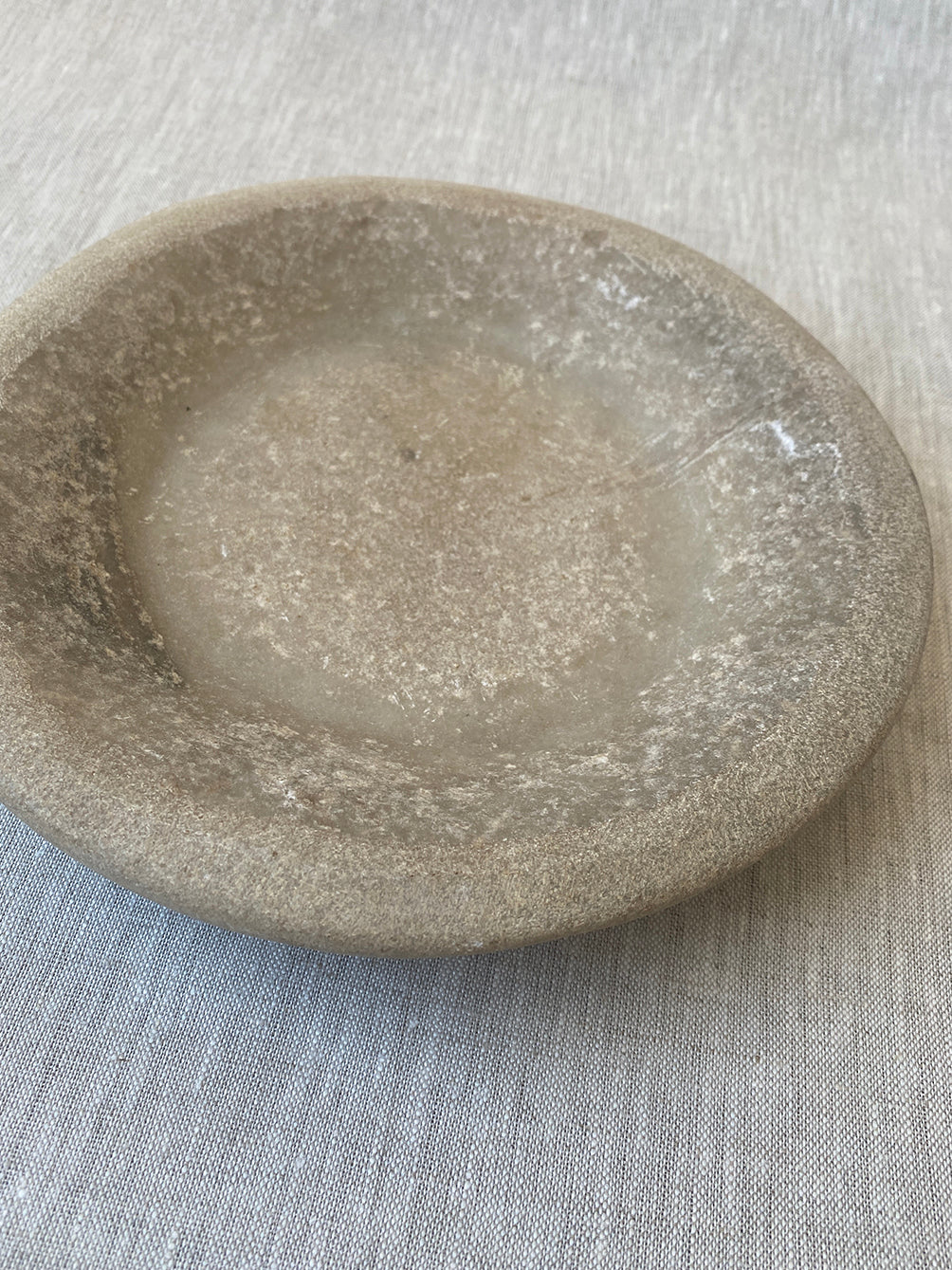 a hand-carved Indian marble bowl with an organic form and texture