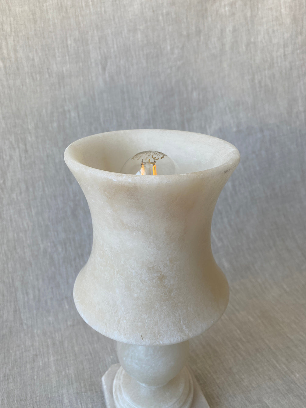 a small vintage Italian-inspired white marble lamp