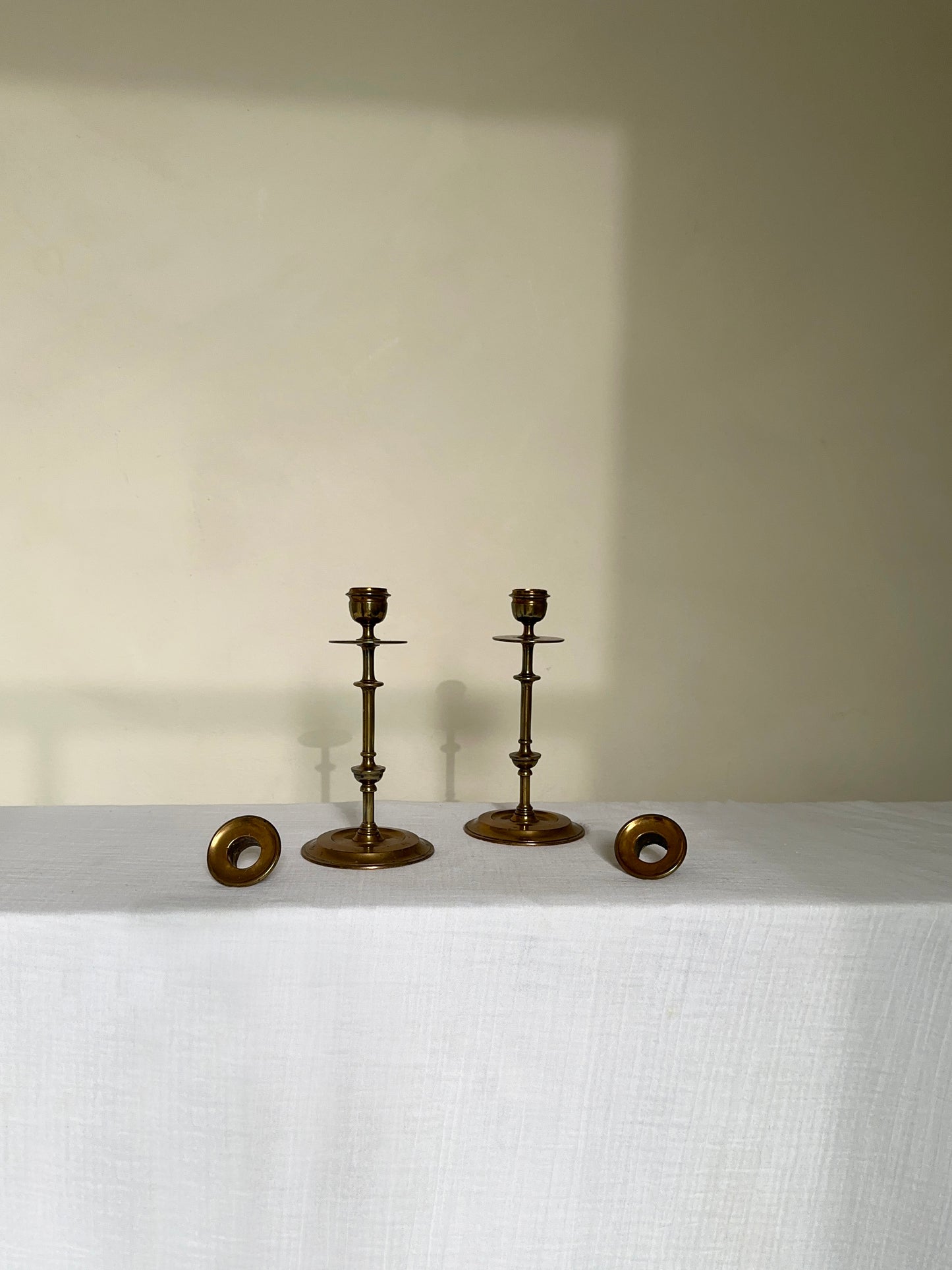 a beautiful pair of antique brass candlesticks 