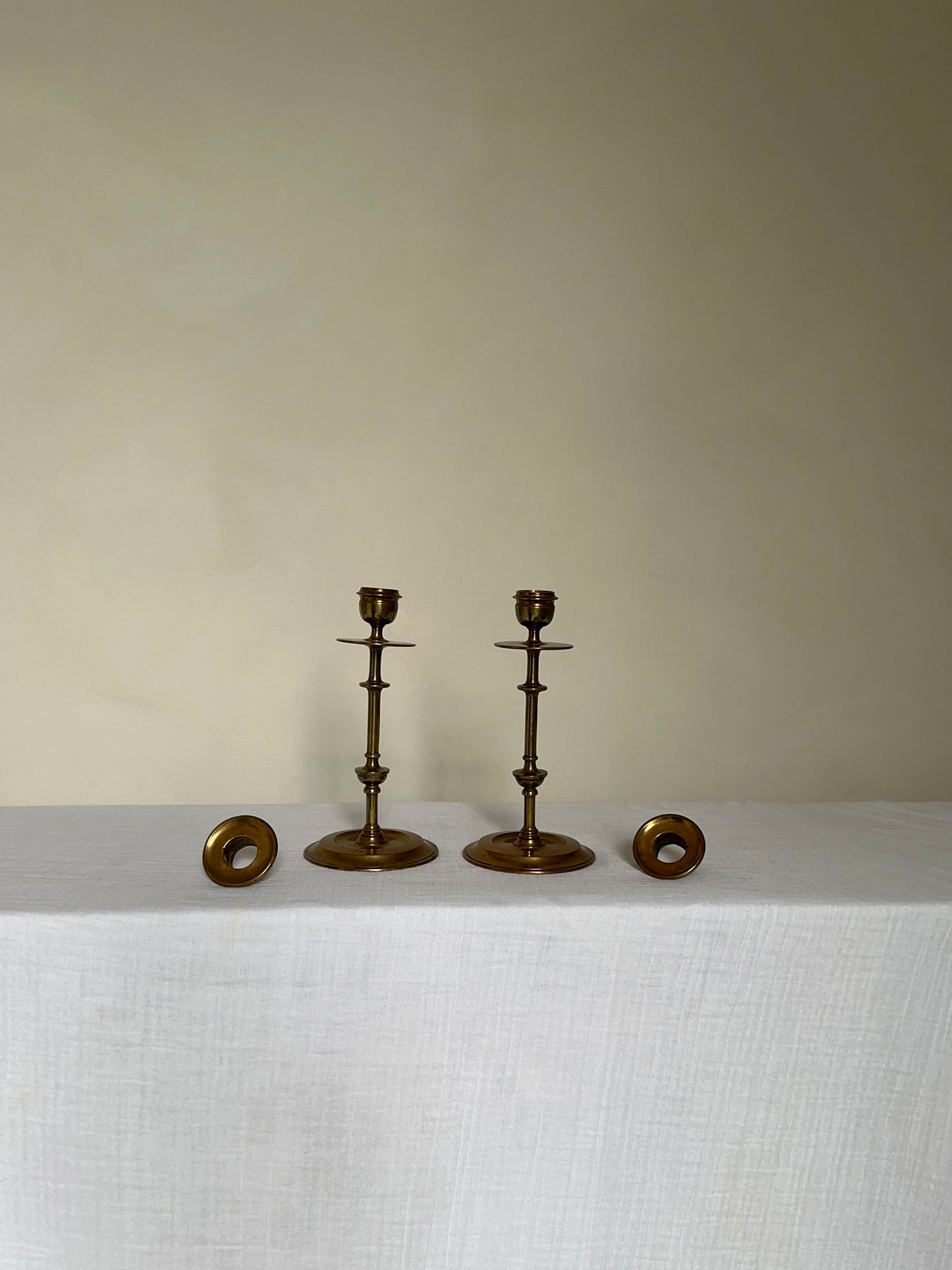 a beautiful pair of antique brass candlesticks 