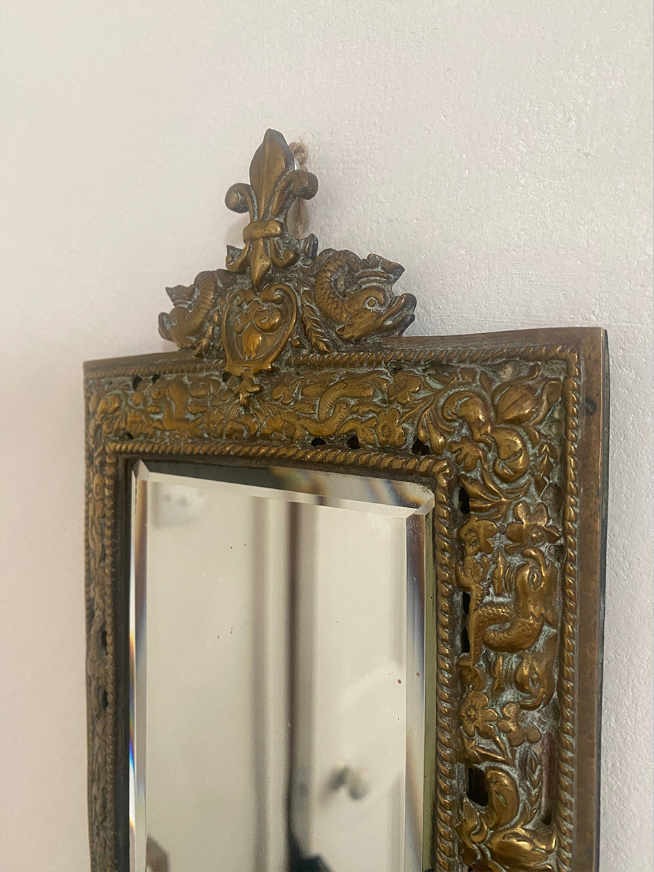 a beautiful cast-brass baroque-style with a fish and fleur-de-lis design