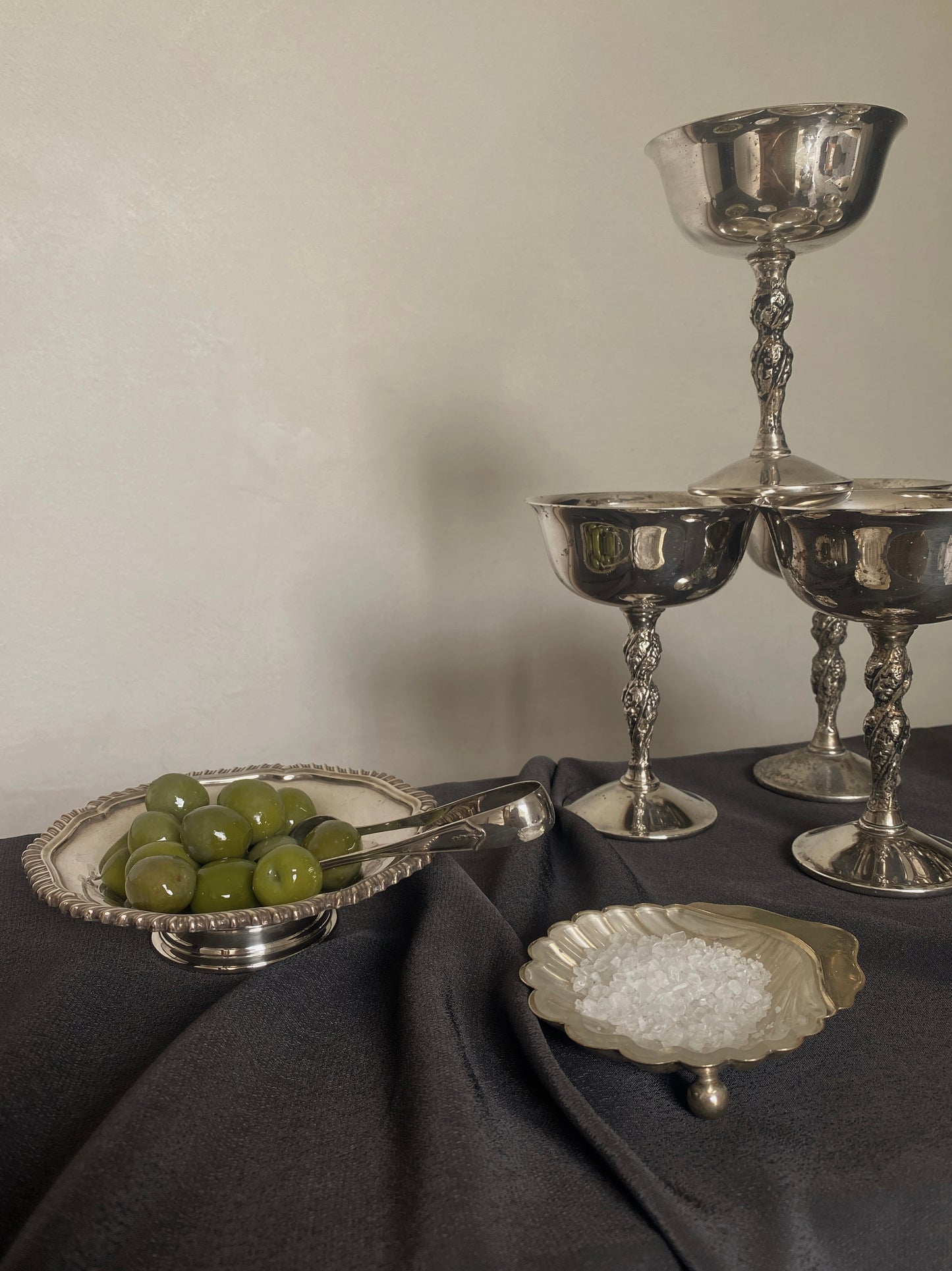 a small silver-plated trinket dish with elevated base