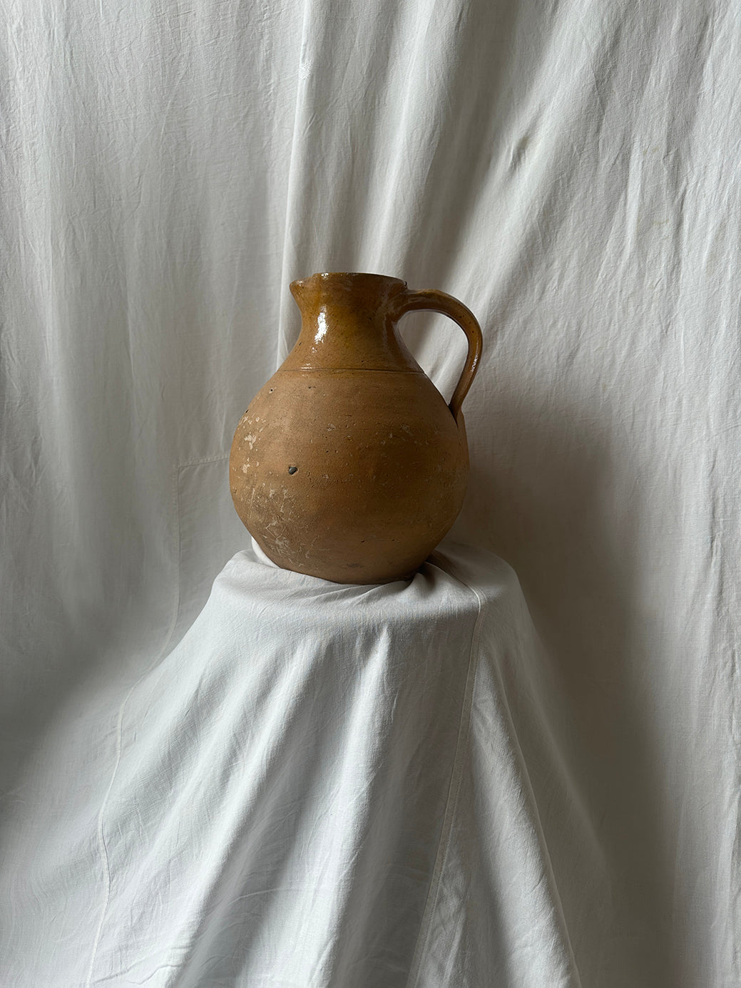 Antique earthenware jug