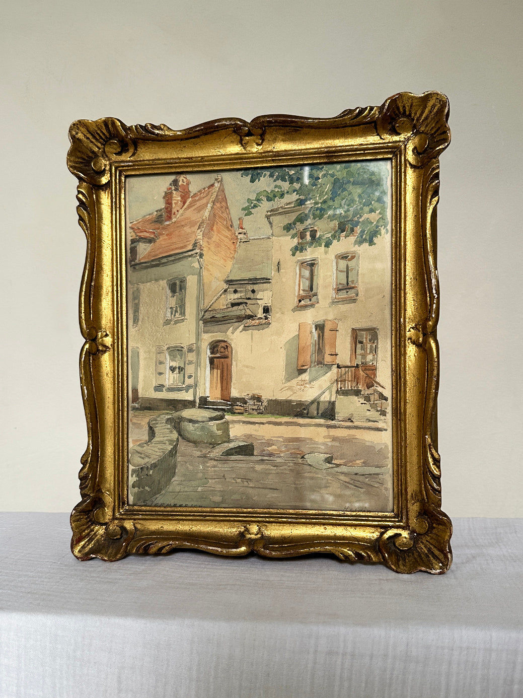 a beautiful watercolour painting in a pastel tones, depicting the historic french town of Hesdin