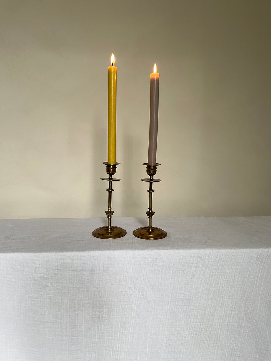 a beautiful pair of antique brass candlesticks 