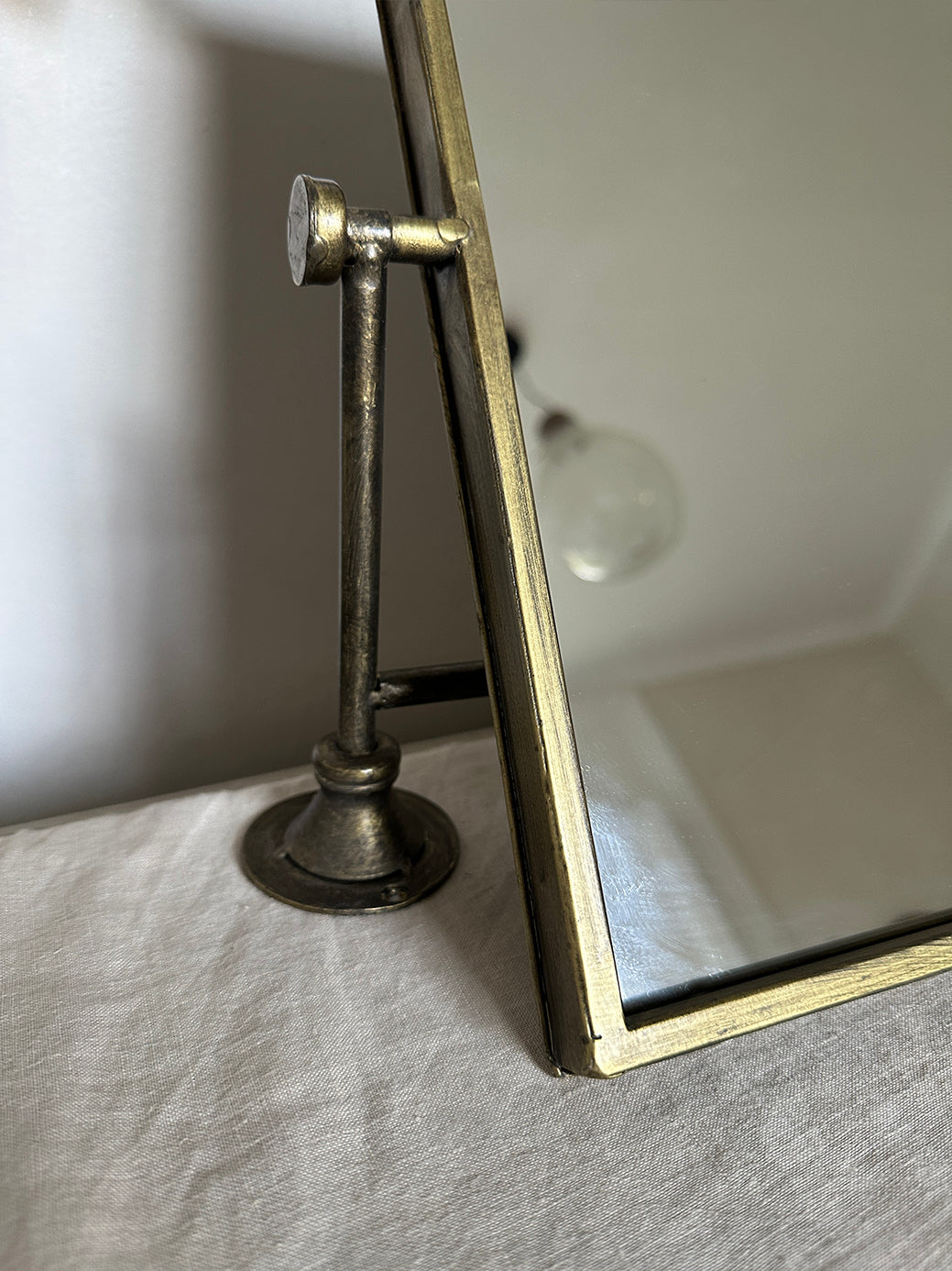 pair of vintage brass mirrors on swivel wall mounts