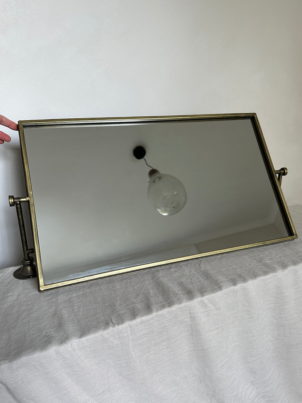 pair of vintage brass mirrors on swivel wall mounts