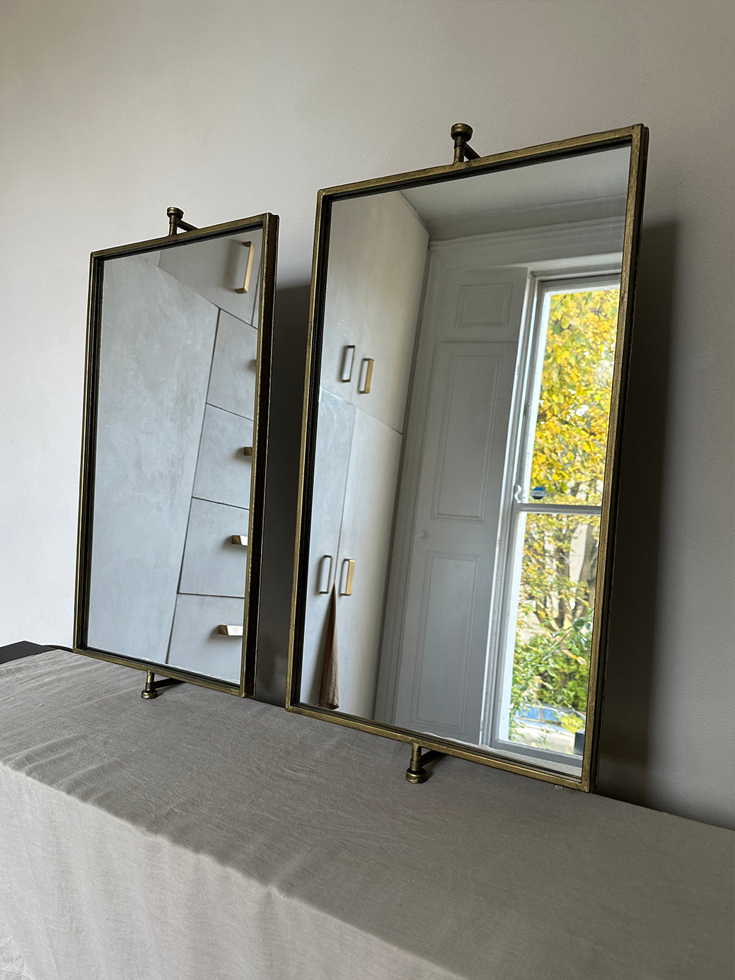 Pair of vintage swivel wall mirrors