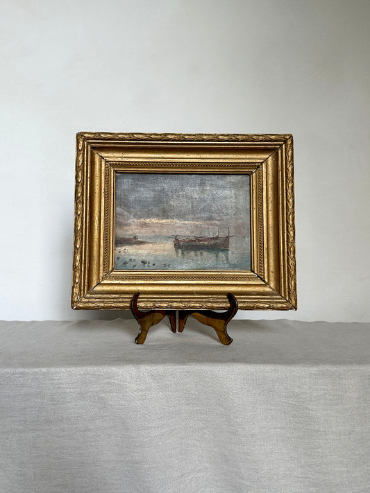 a small antique oil seascape with an ornate gilt frame