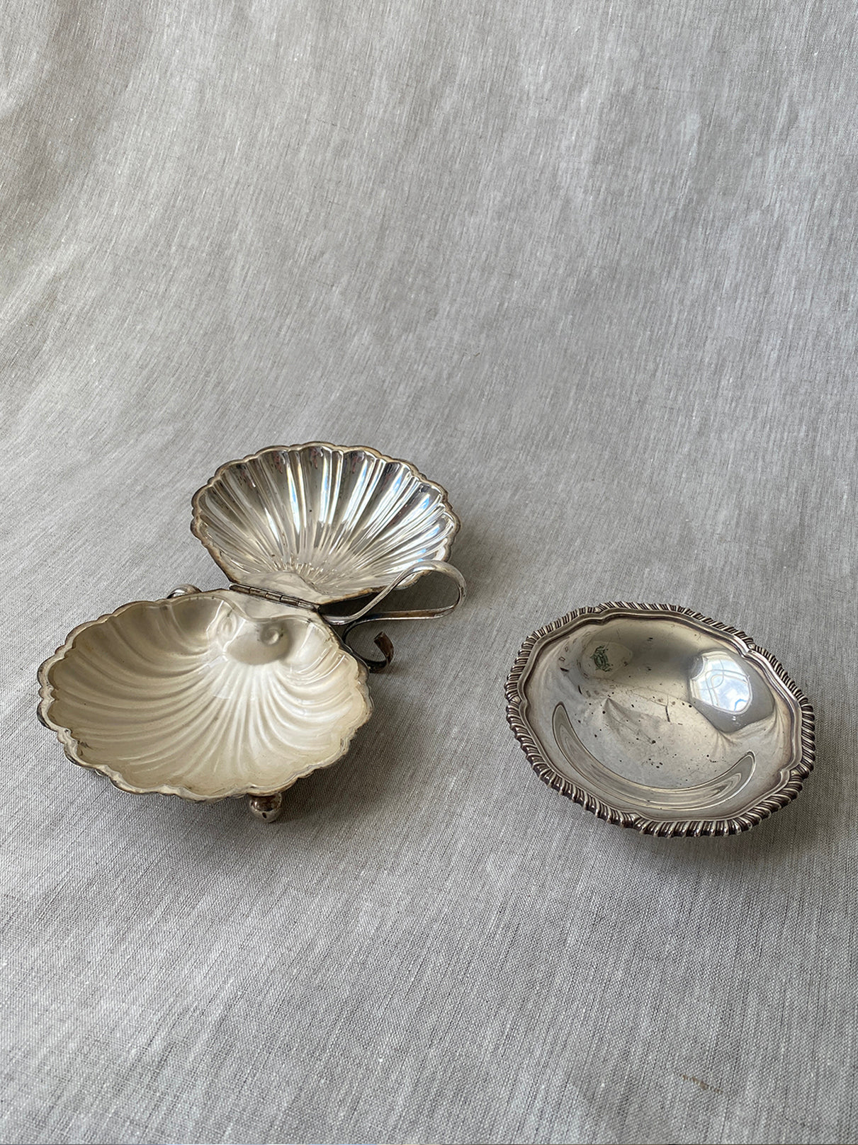 a small silver-plated trinket dish with elevated base