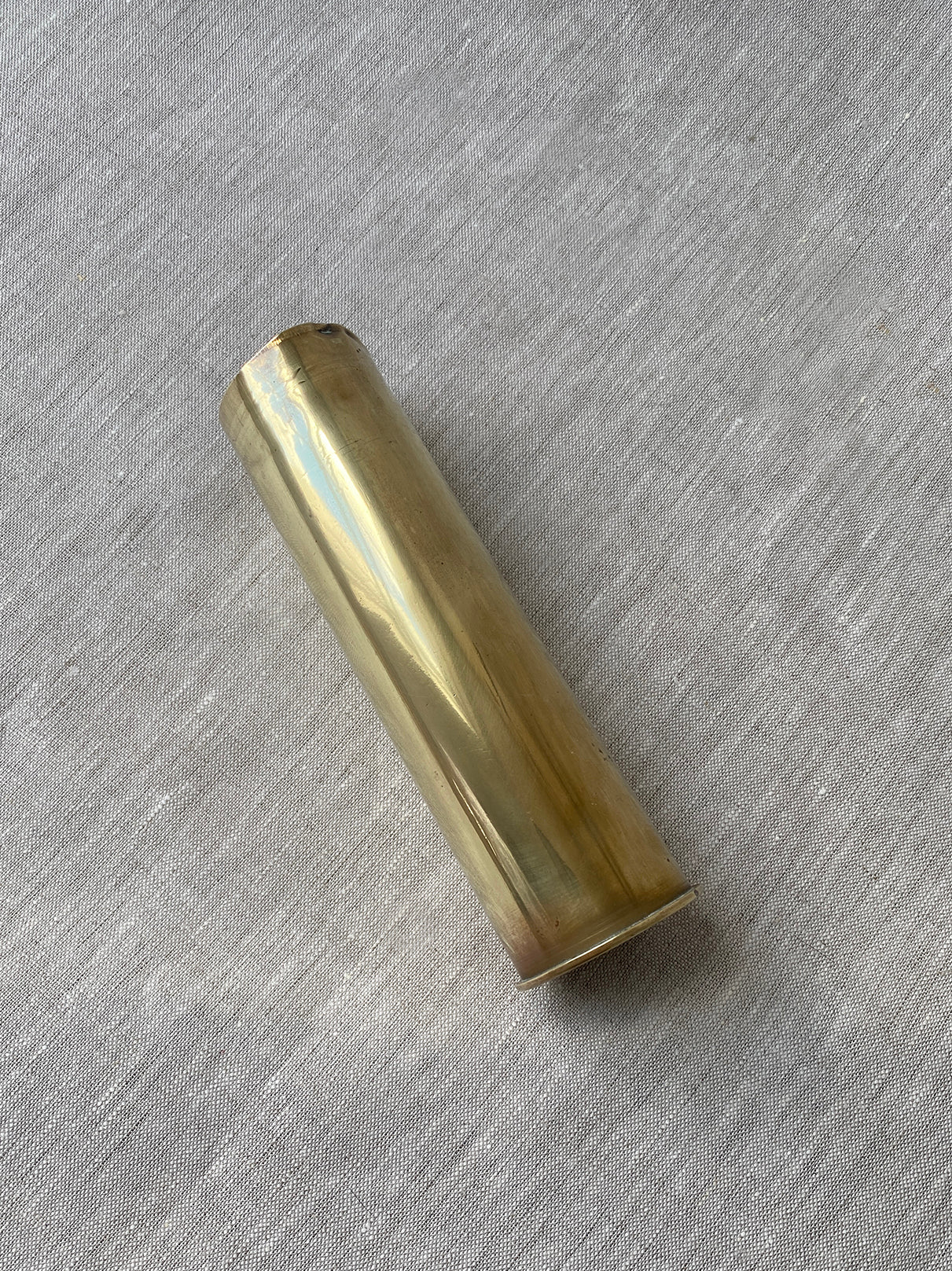 a small brass antique artillery shell 