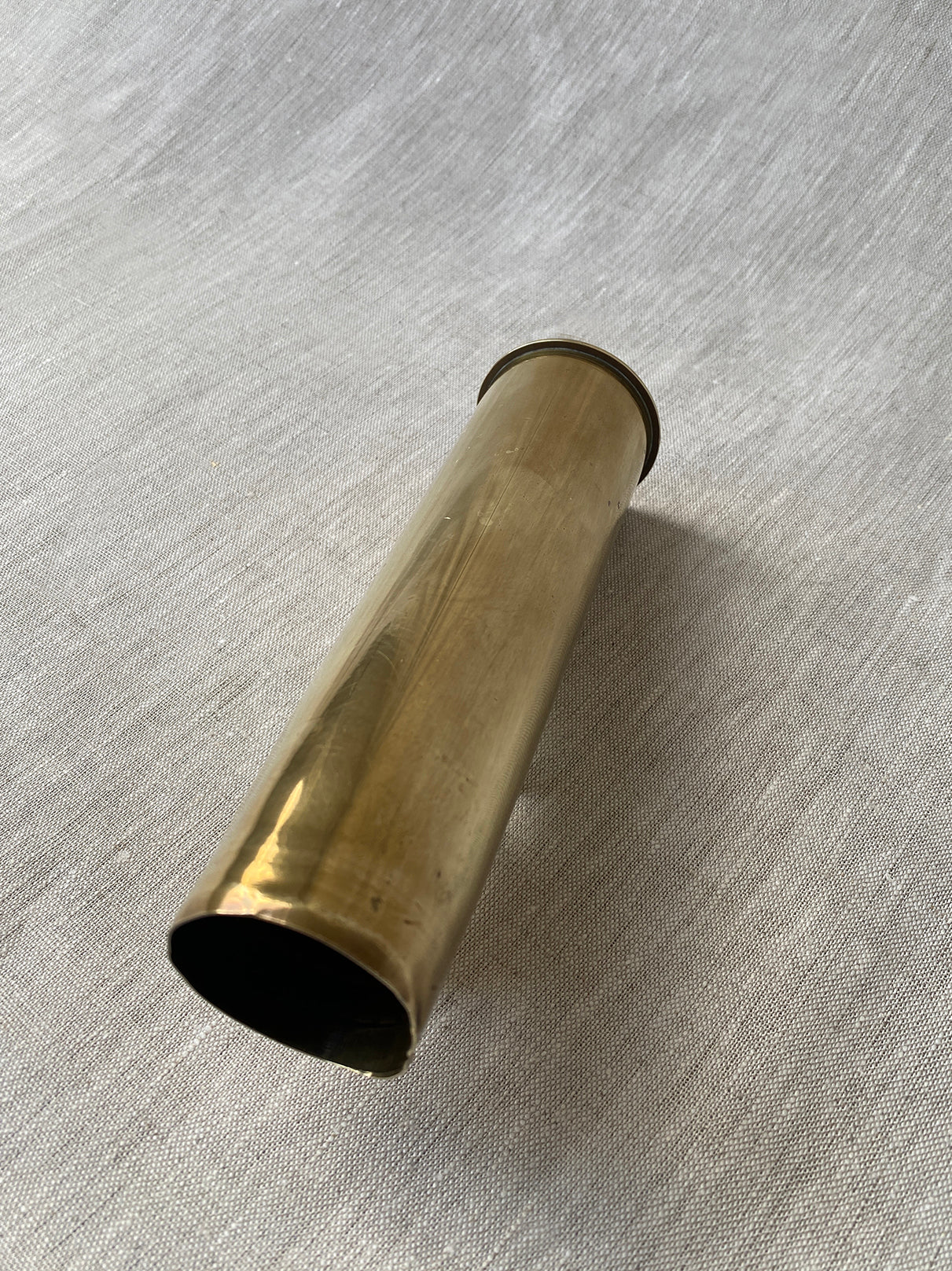 a small brass antique artillery shell 