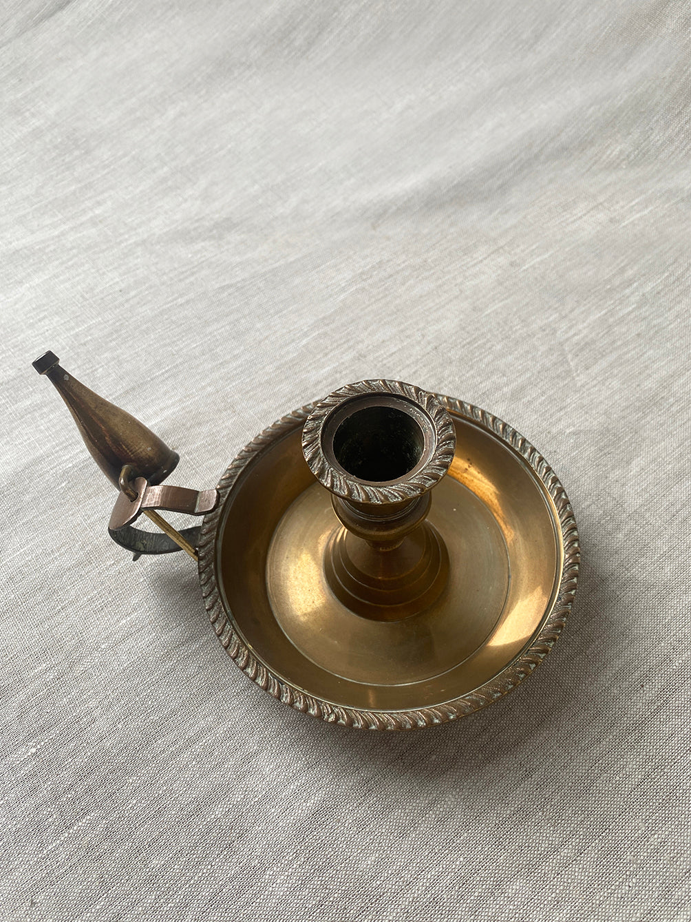 Antique brass chamberstick with snuffer