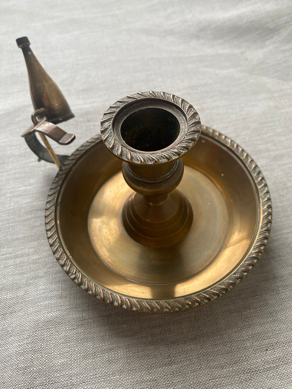 Antique brass chamberstick with snuffer