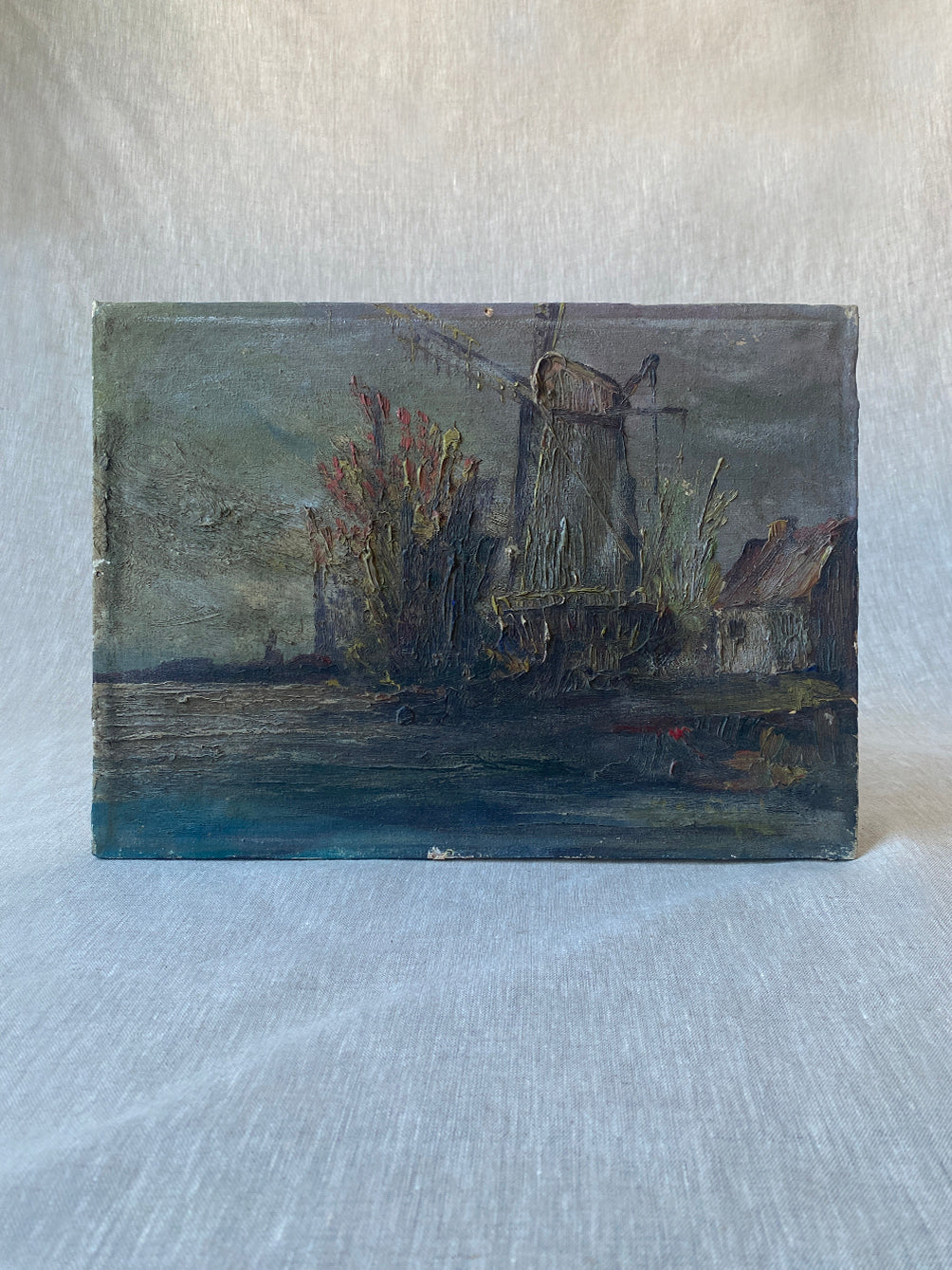 a vintage seascape painting with heavily applied oil paint on canvas frame