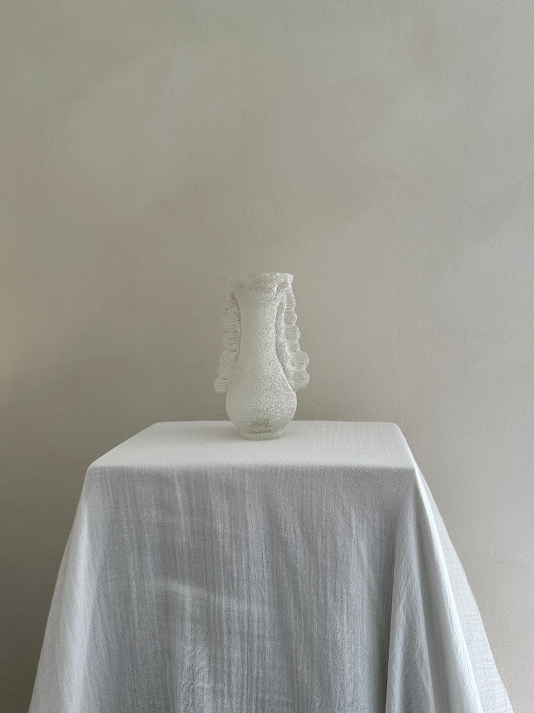 a vintage white vase from the highly celebrated murano scavo collection 