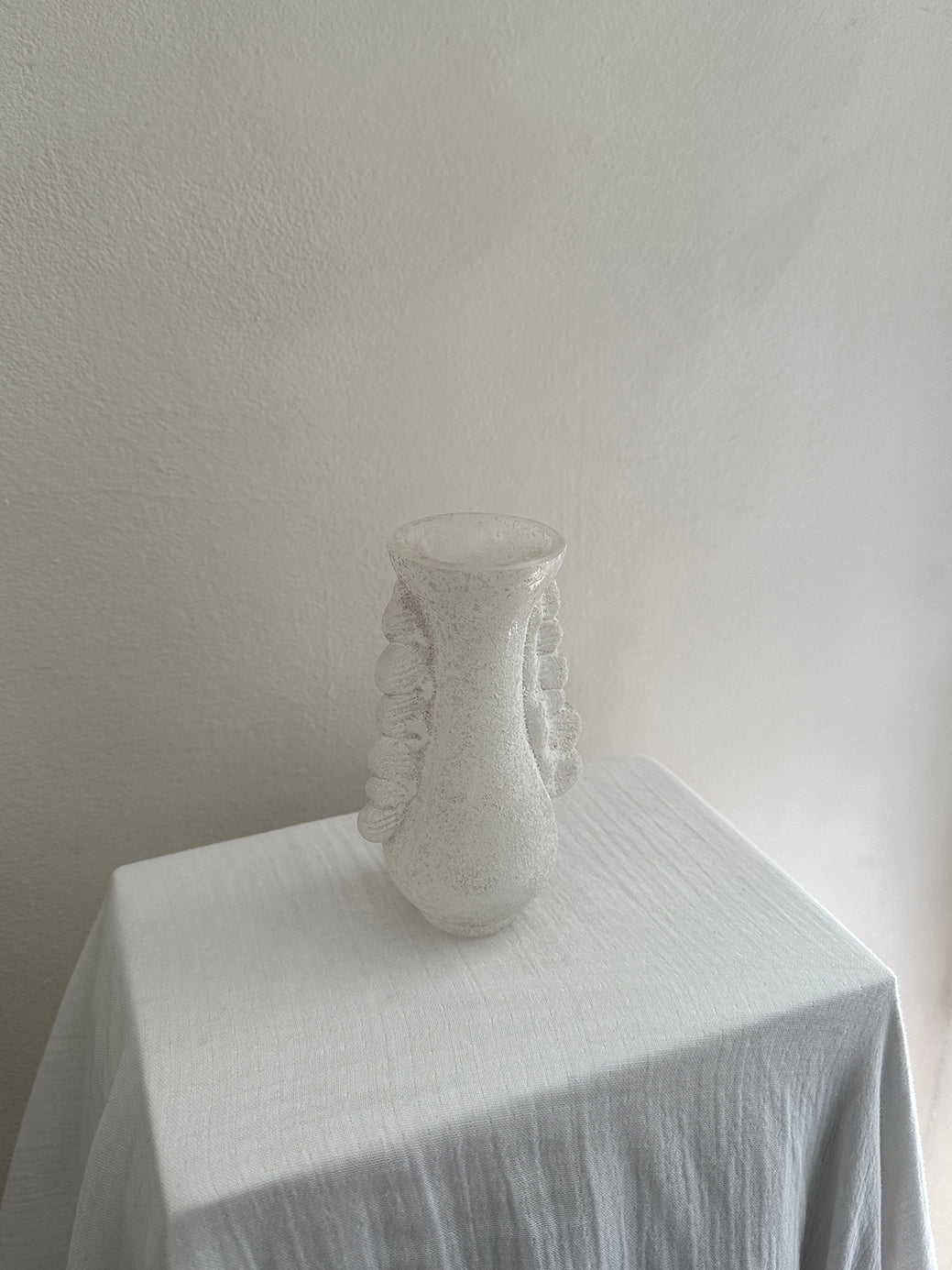 a vintage white vase from the highly celebrated murano scavo collection 