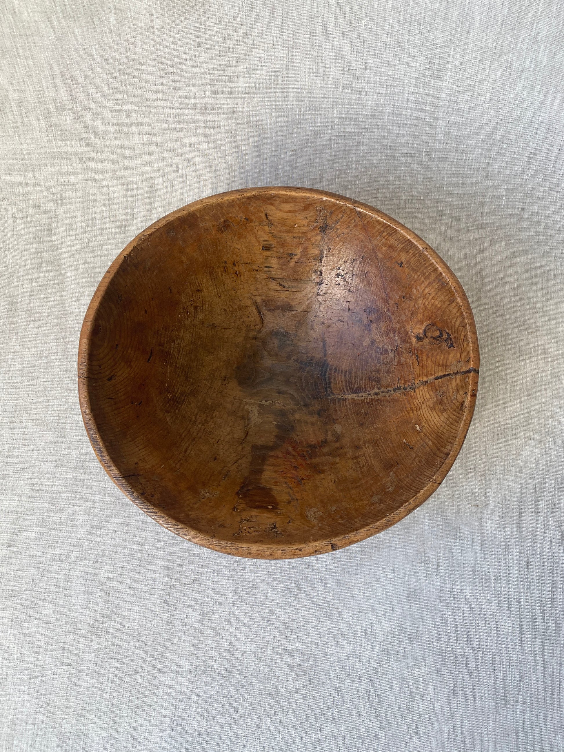 a wabi sabi style antique wooden dough bowl with an organic feel and pretty patina