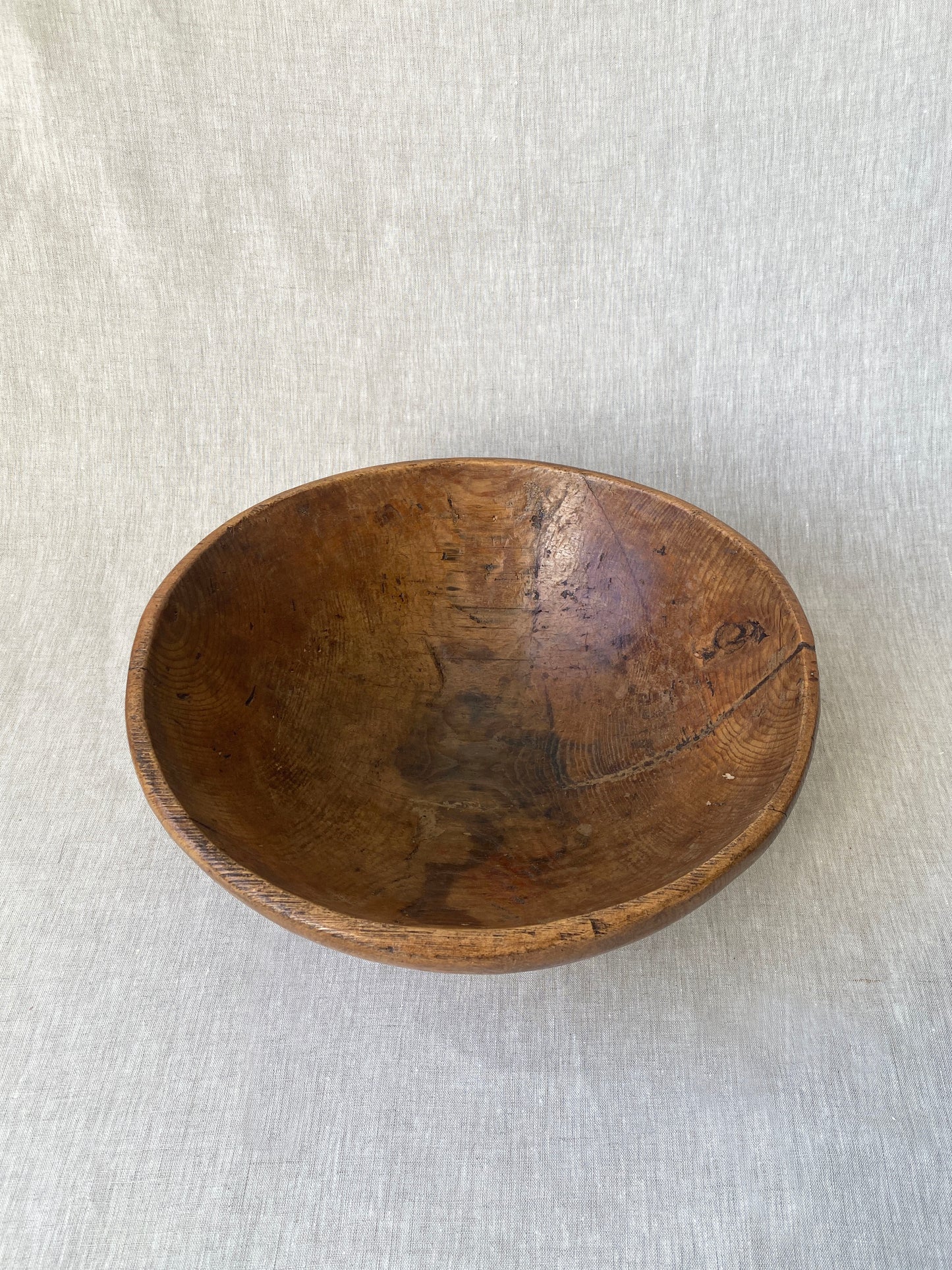 a wabi sabi style antique wooden dough bowl with an organic feel and pretty patina