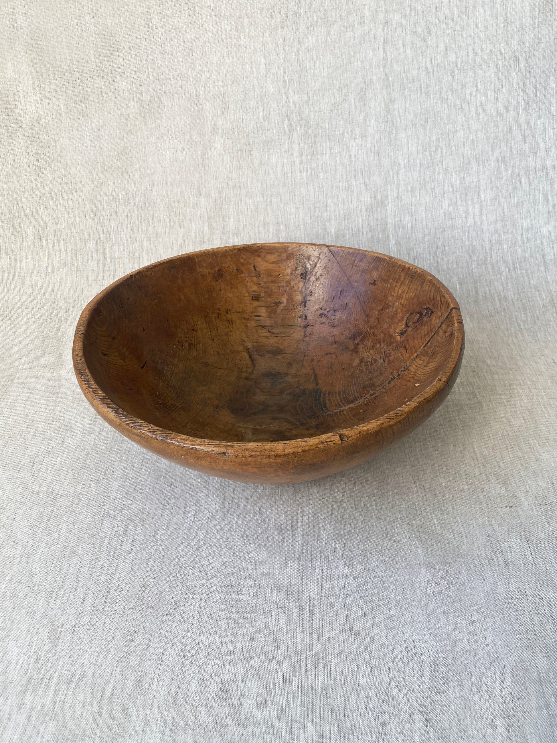 a wabi sabi style antique wooden dough bowl with an organic feel and pretty patina