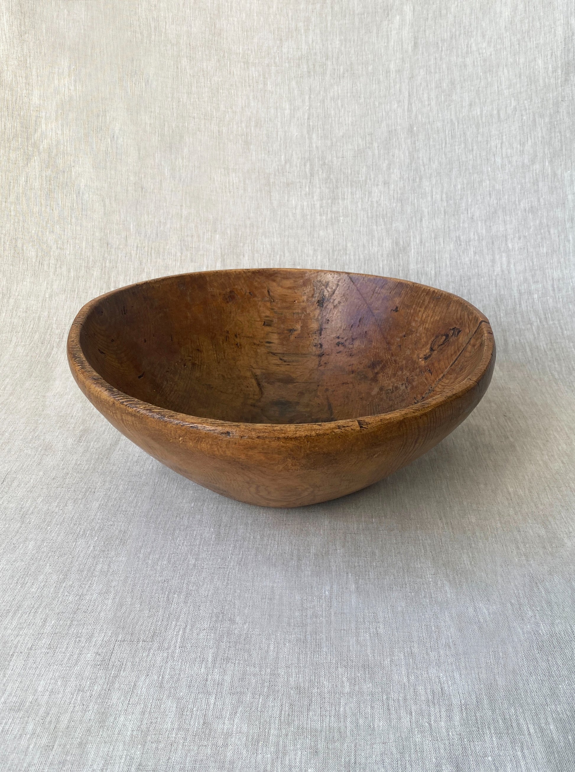 a wabi sabi style antique wooden dough bowl with an organic feel and pretty patina