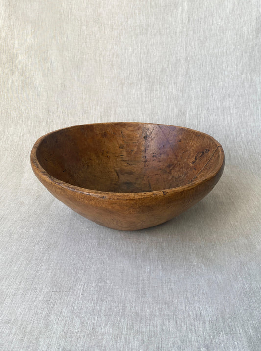 a wabi sabi style antique wooden dough bowl with an organic feel and pretty patina