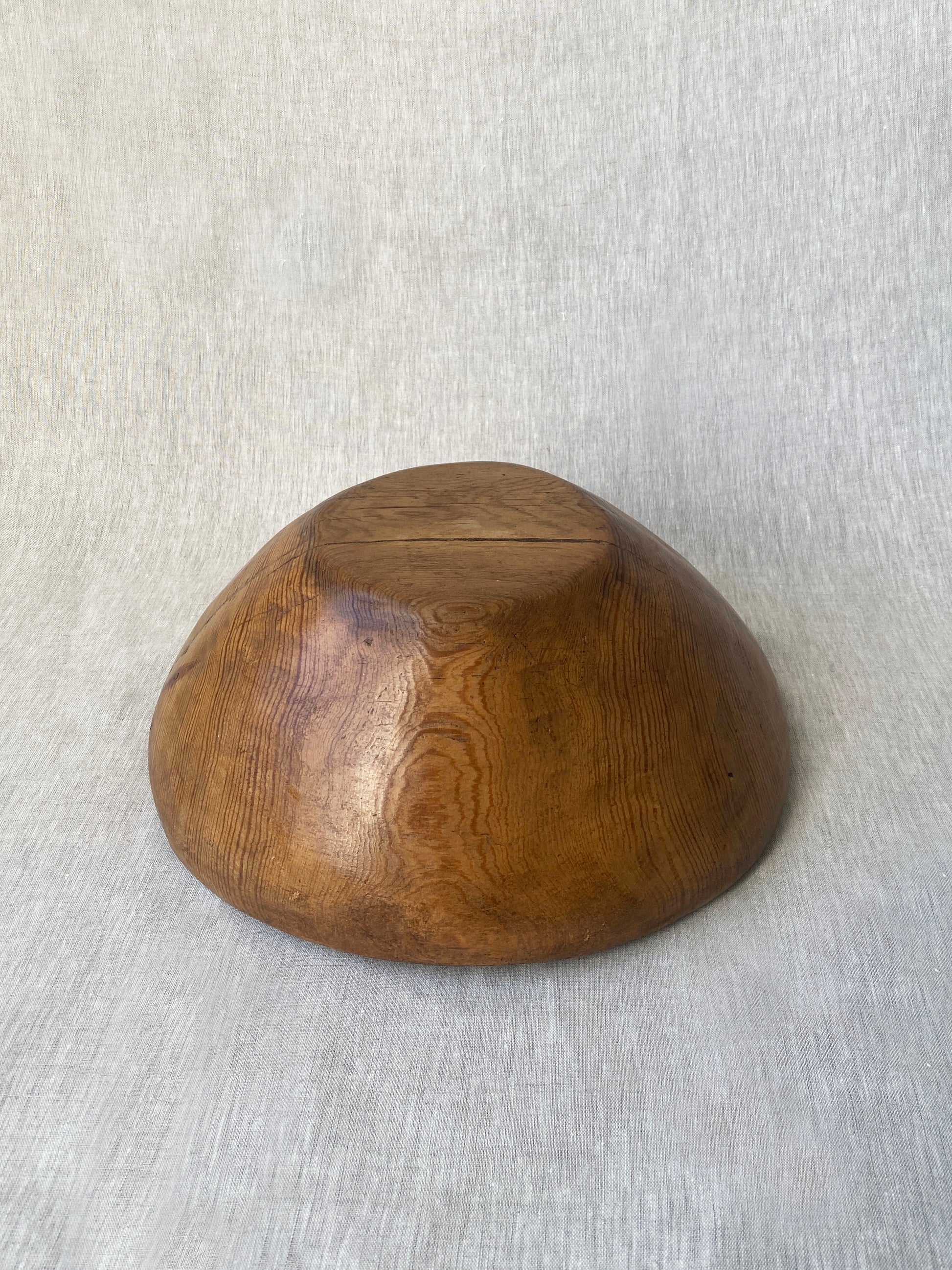 a wabi sabi style antique wooden dough bowl with an organic feel and pretty patina