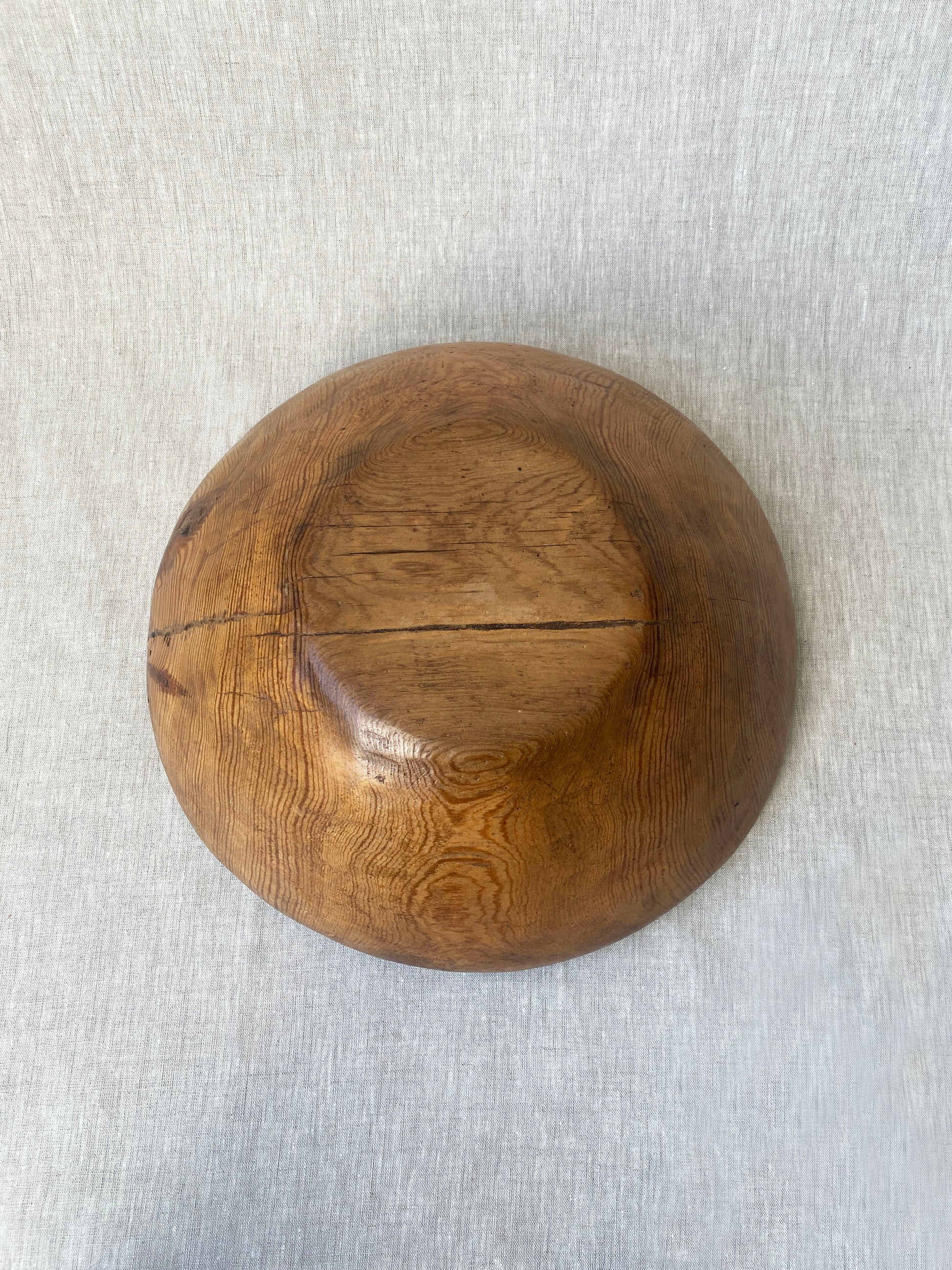 a wabi sabi style antique wooden dough bowl with an organic feel and pretty patina