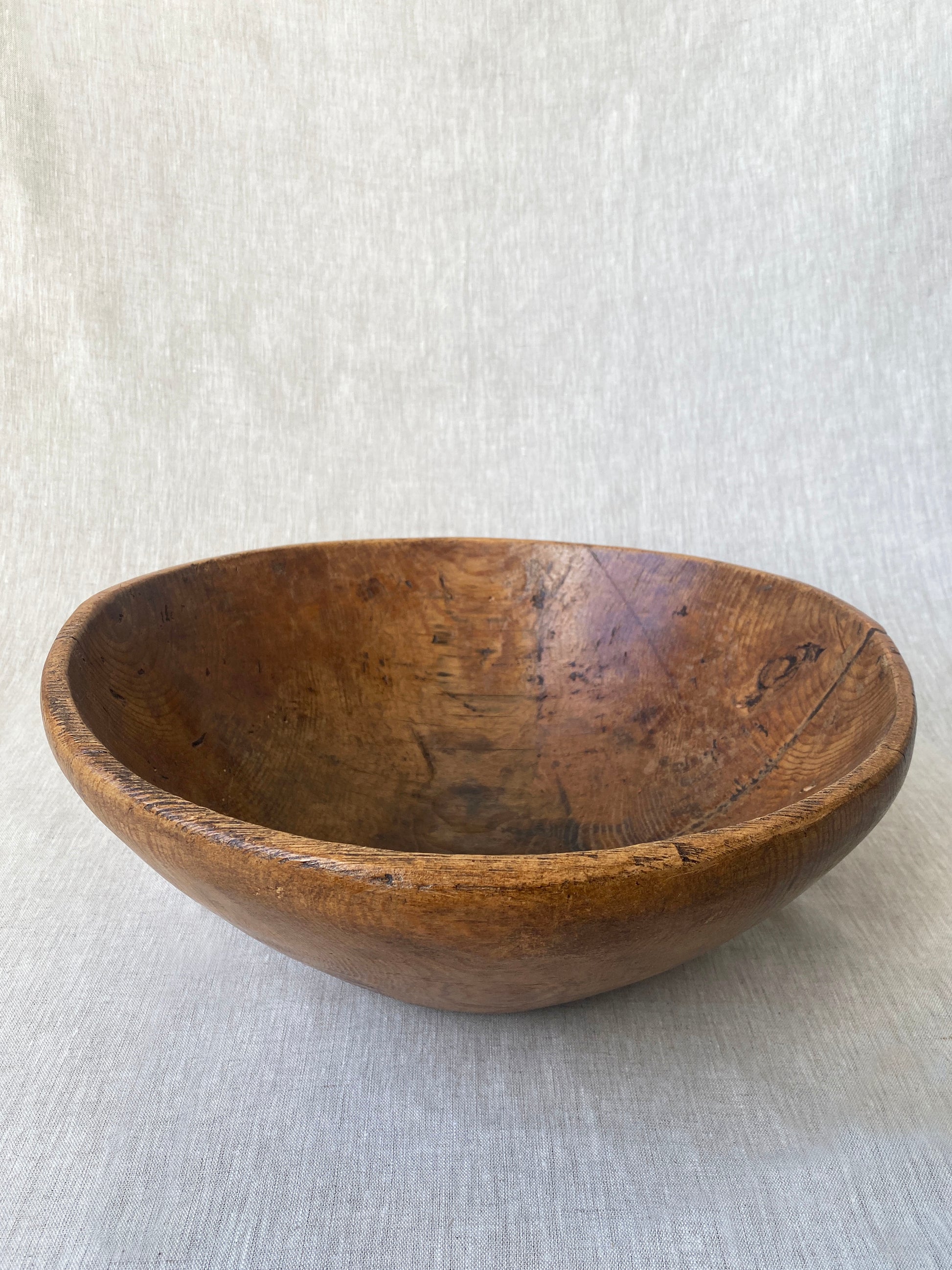 a wabi sabi style antique wooden dough bowl with an organic feel and pretty patina