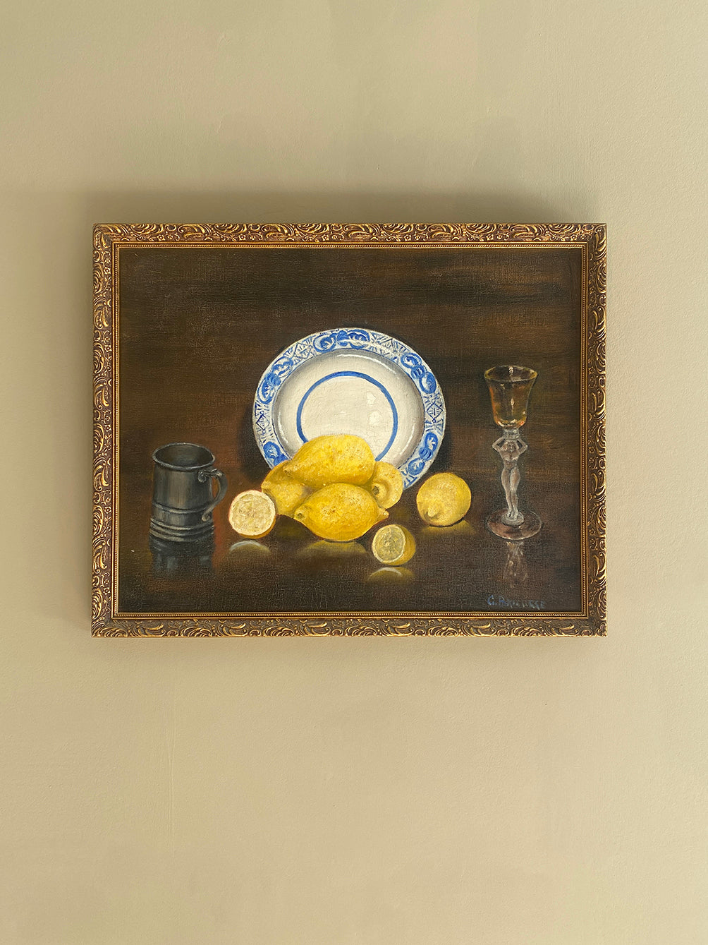a vintage oil painting in a gold gilt frame