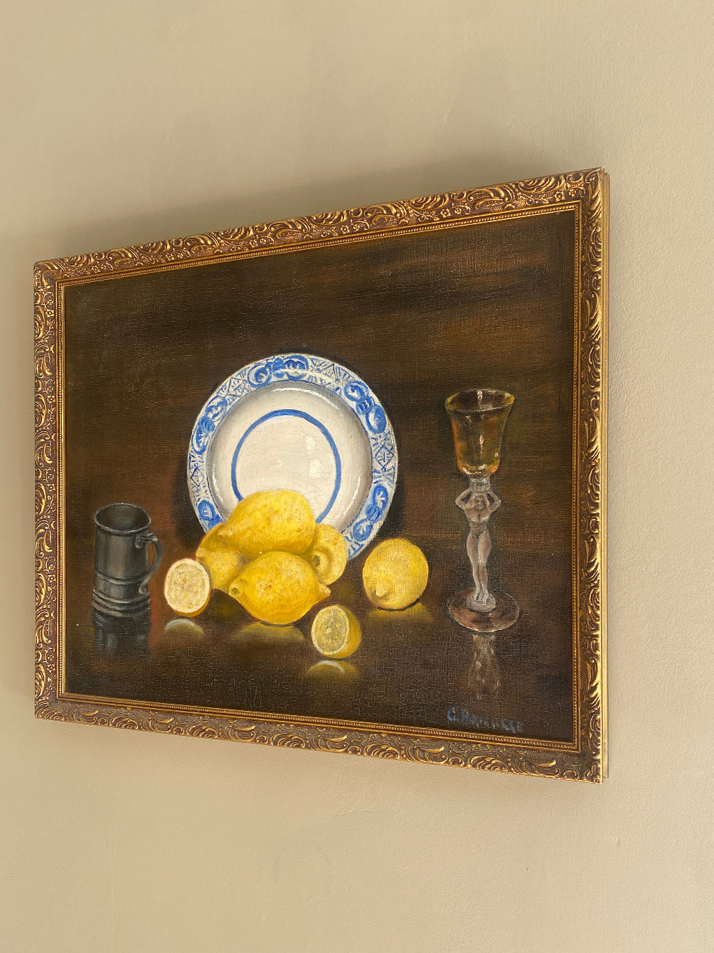 a vintage oil painting in a gold gilt frame