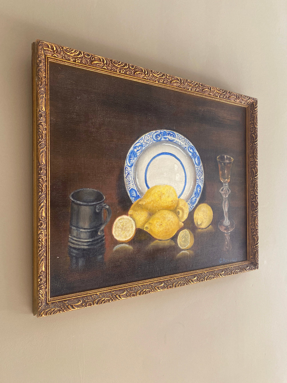 a vintage oil painting in a gold gilt frame