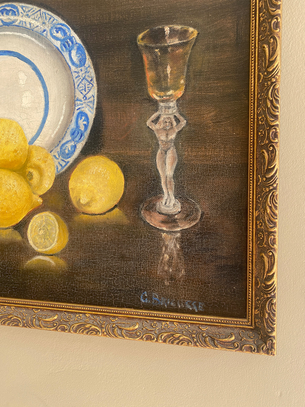 a vintage oil painting in a gold gilt frame