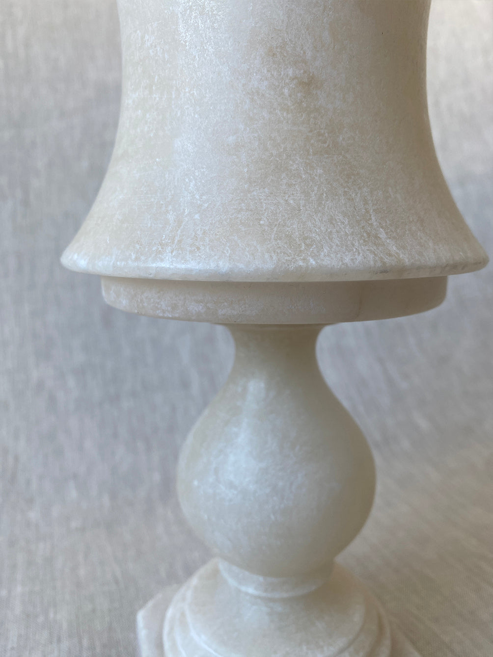 a small vintage Italian-inspired white marble lamp 