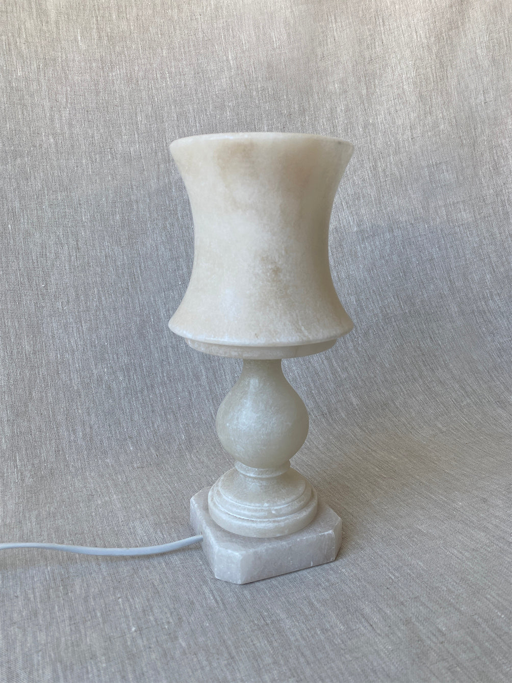 a small vintage Italian-inspired white marble lamp 