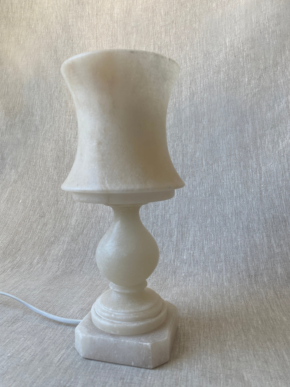 a small vintage Italian-inspired white marble lamp 