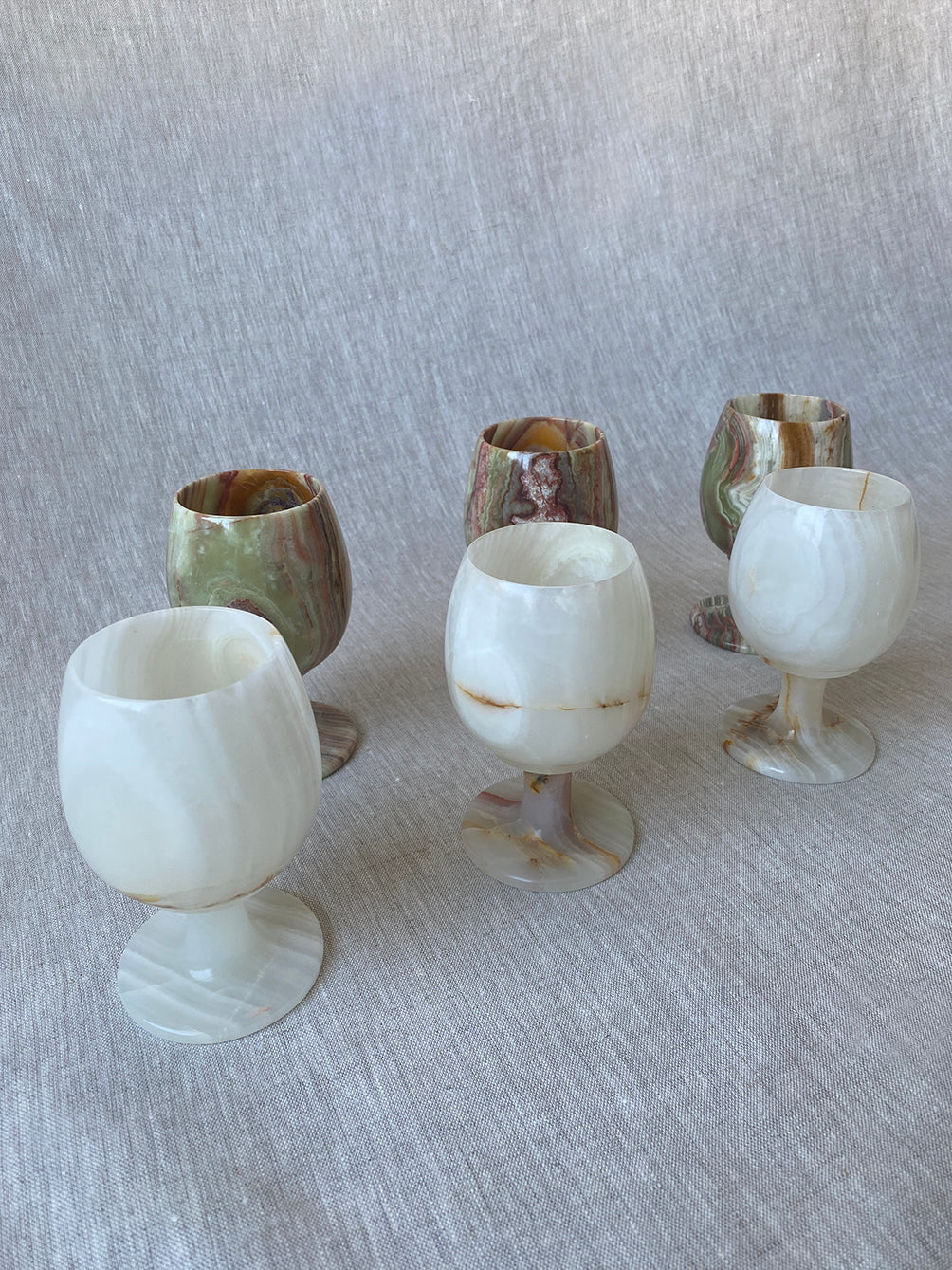 a set of vintage onyx goblets in natural stone marble